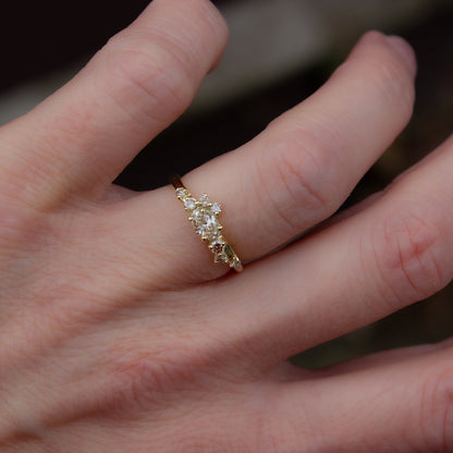 Alternative, modern engagement ring featuring beautiful champagne diamonds organically wrapped along the band.