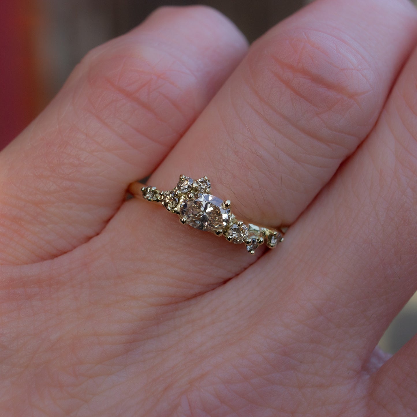 Alternative, modern engagement ring featuring beautiful champagne diamonds organically wrapped along the band.
