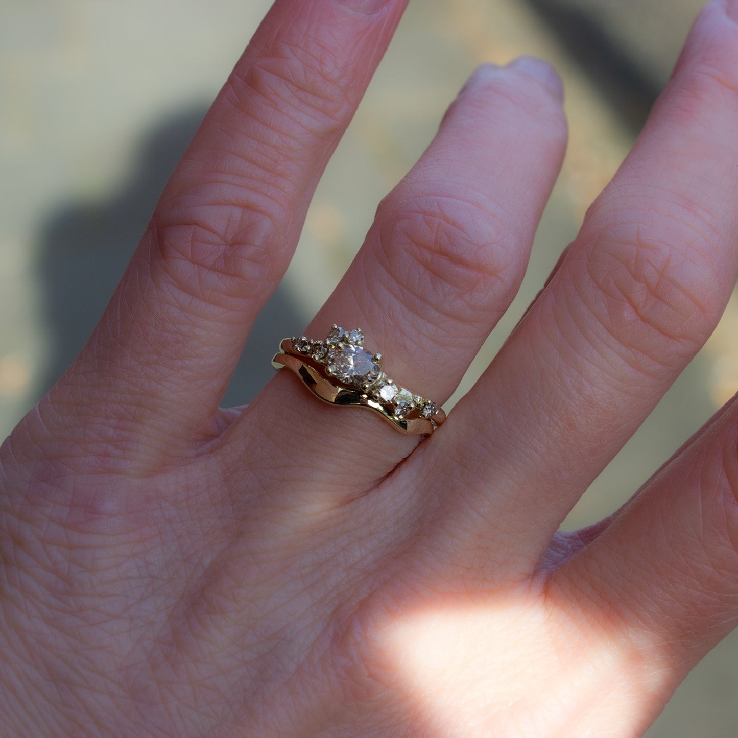 Organically shaped, flowy gold band. Paired with perfectly matching alternative engagement ring, glimmering with brown diamonds.