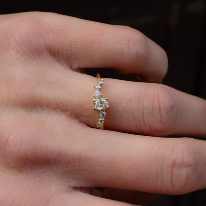 Alternative engagement ring featuring champagne and white diamonds and inspired by flow of natural forms.