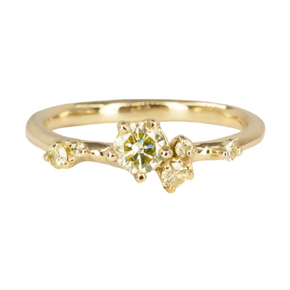 Alternative engagement ring featuring natural yellow diamonds organically scattered along the band. Ring is inspired by first flower buds.