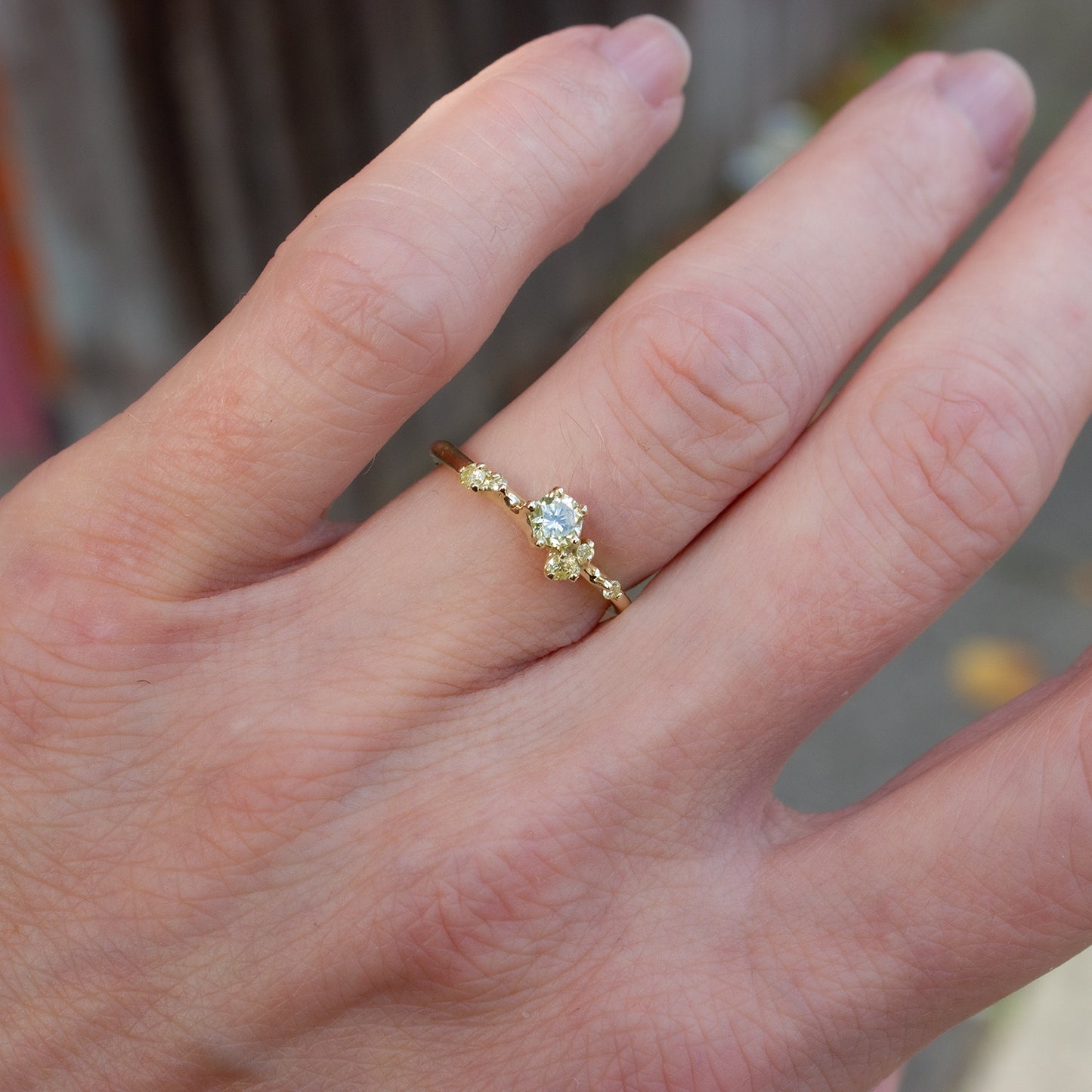 Alternative engagement ring featuring natural yellow diamonds organically scattered along the band. Ring is inspired by first flower buds.